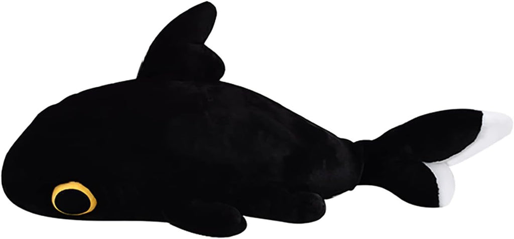 Black plush shark toy with a gold eye on a white background