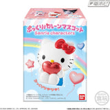 Sanrio Hello Kitty puffy balloon mascot featuring a white Hello Kitty figure with a red bow, holding a shiny red heart, displayed alongside its colourful product packaging.