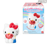 Sanrio Hello Kitty puffy balloon mascot featuring a white Hello Kitty figure with a red bow, holding a shiny red heart, displayed alongside its colourful product packaging.
