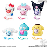 Sanrio Hello Kitty puffy balloon mascot featuring a white Hello Kitty figure with a red bow, holding a shiny red heart, displayed alongside its colourful product packaging.