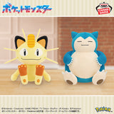 Banpresto Pokémon plush toys featuring yellow Meowth with its signature forehead coin and whiskers, alongside blue-and-cream Snorlax with a round body and sleepy expression.