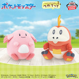 Banpresto Pokémon plush toys featuring pink Lucky with a round body and white belly, alongside orange-and-white Hogeta with a yellow head feather and dark blue claws.