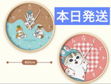 MOFUSAND wall clock sweets design with clear numerals and cute character, hanging on a wall