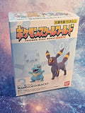 Pokemon Scale World Johto Region Totodile and Umbreon figures by Bandai, showcasing the detailed design and color of the figures.